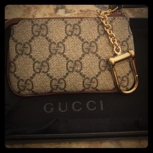 Gucci change purse key chain.